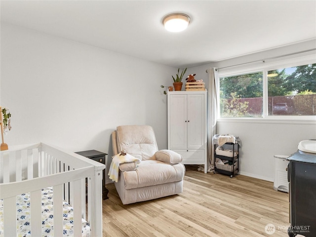 8839 S Yakima Ave, Tacoma, WA 98444 - bedroom with light wood finished floors and a nursery area