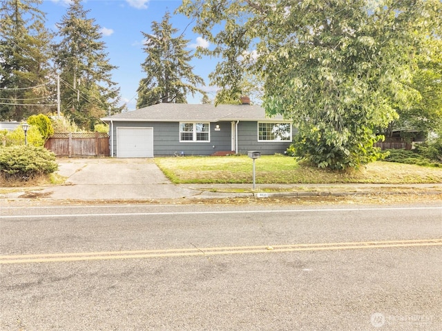 8839 S Yakima Ave, Tacoma, WA 98444 - ranch-style home featuring a chimney, concrete driveway, and a garage
