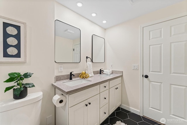 22720 90th Ave W, Edmonds, WA 98026 - bathroom featuring double vanity, tile patterned flooring, and recessed lighting