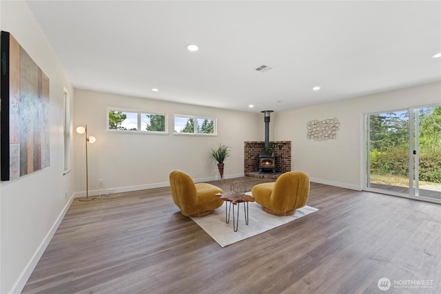 22720 90th Ave W, Edmonds, WA 98026 - sitting room featuring a wood stove, healthy amount of natural light, wood finished floors, and recessed lighting