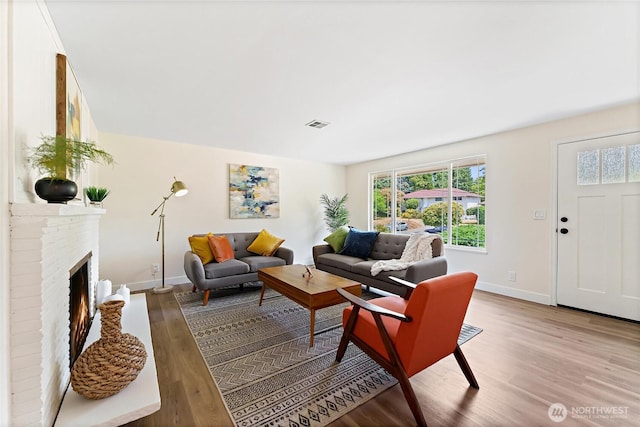 22720 90th Ave W, Edmonds, WA 98026 - living area with light wood-type flooring and a brick fireplace