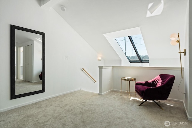 1926 Fairview Ave E Unit 307, Seattle, WA 98102 - living area featuring a skylight, lofted ceiling, an upstairs landing, and carpet flooring