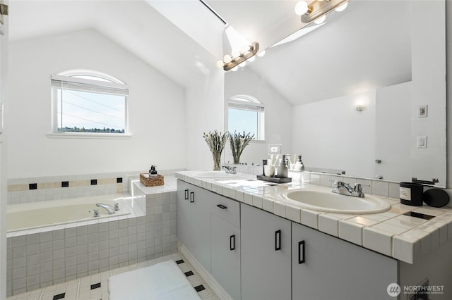 1926 Fairview Ave E Unit 307, Seattle, WA 98102 - bathroom with double vanity, vaulted ceiling, and a bath