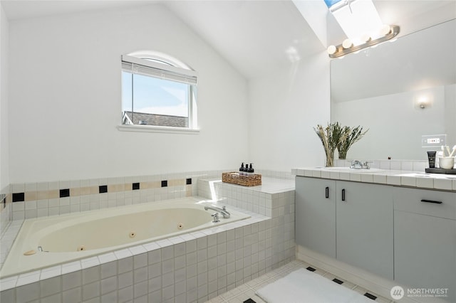 1926 Fairview Ave E Unit 307, Seattle, WA 98102 - full bath featuring vanity, lofted ceiling, a whirlpool tub, and tile patterned floors
