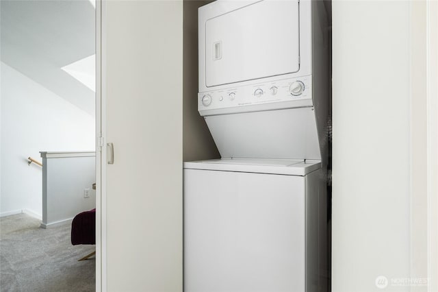 1926 Fairview Ave E Unit 307, Seattle, WA 98102 - laundry room featuring stacked washing machine and dryer and carpet floors