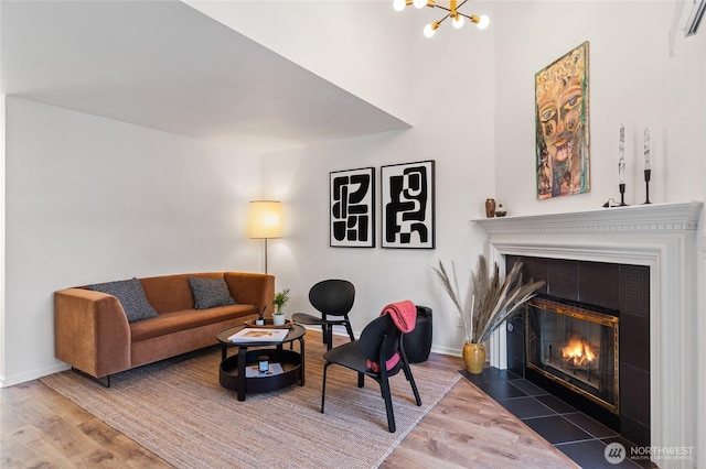 1926 Fairview Ave E Unit 307, Seattle, WA 98102 - living room with wood finished floors, a fireplace, and a chandelier