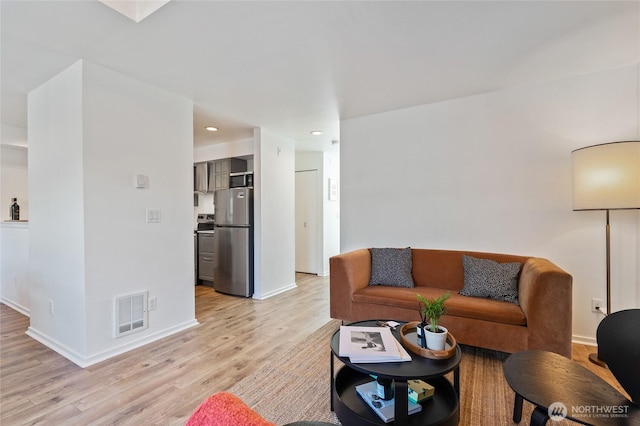1926 Fairview Ave E Unit 307, Seattle, WA 98102 - living room with light wood-style flooring and recessed lighting