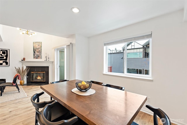 1926 Fairview Ave E Unit 307, Seattle, WA 98102 - dining space with wood finished floors, a tile fireplace, and recessed lighting