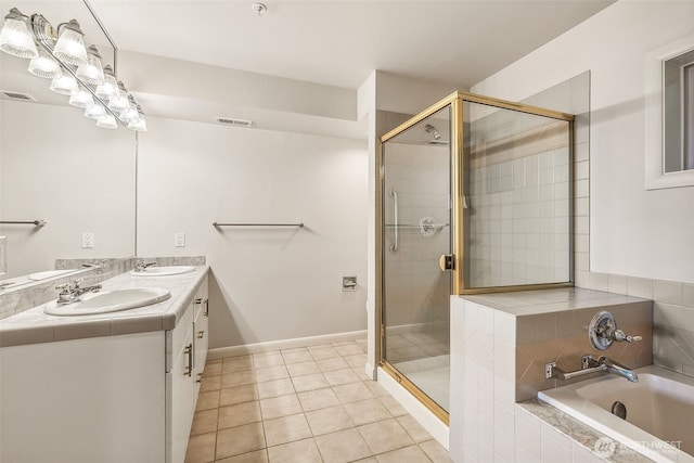 1300 Alki Ave SW Unit 100, Seattle, WA 98116 - full bath featuring a bath, double vanity, tile patterned floors, and a stall shower