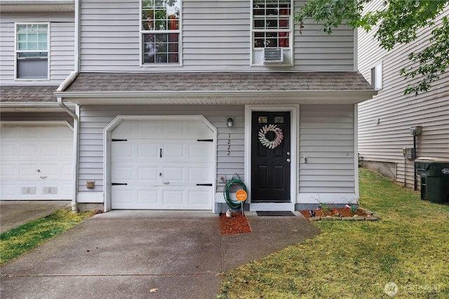 1222 Cora St SE, Lacey, WA 98503 - entrance to property featuring an attached garage, driveway, a shingled roof, and a yard