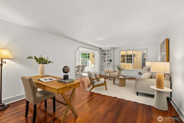 3322 Pacific Way, Longview, WA 98632 - home office featuring wood finished floors, a textured ceiling, and arched walkways