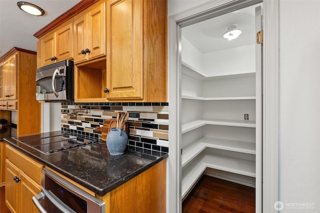3322 Pacific Way, Longview, WA 98632 - kitchen with stainless steel microwave, black electric stovetop, decorative backsplash, dark wood finished floors, and wall oven