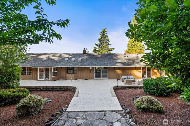 3322 Pacific Way, Longview, WA 98632 - ranch-style house featuring an outdoor living space, a shingled roof, a patio area, and a chimney