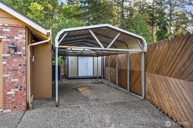 3322 Pacific Way, Longview, WA 98632 - view of parking / parking lot with a carport and a storage shed