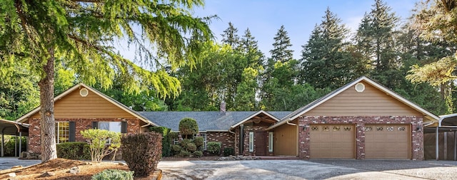 3322 Pacific Way, Longview, WA 98632 - single story home with brick siding, concrete driveway, an attached garage, and a detached carport