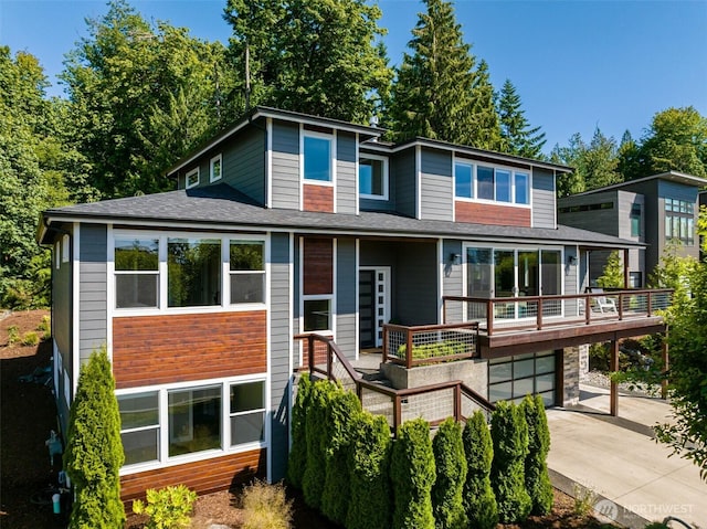 921 Whitewater Dr, Bellingham, WA 98229 - view of front of house with driveway, roof with shingles, a garage, and a wooden deck