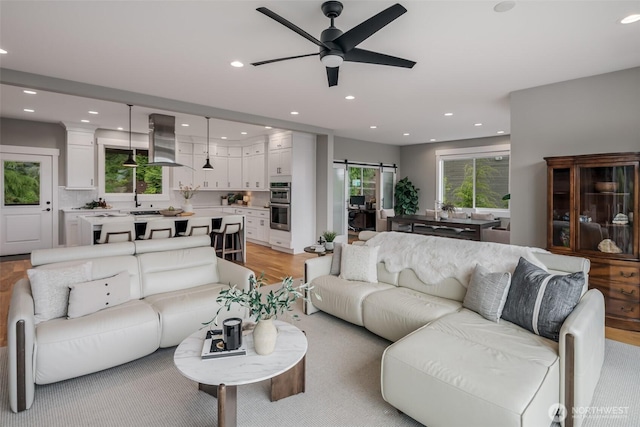 921 Whitewater Dr, Bellingham, WA 98229 - living area featuring ceiling fan, recessed lighting, light wood finished floors, and plenty of natural light