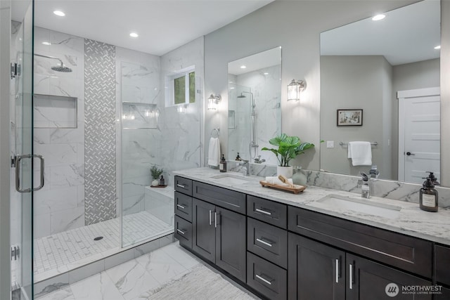 921 Whitewater Dr, Bellingham, WA 98229 - bathroom with marble look tiles, a marble finish shower, double vanity, and recessed lighting