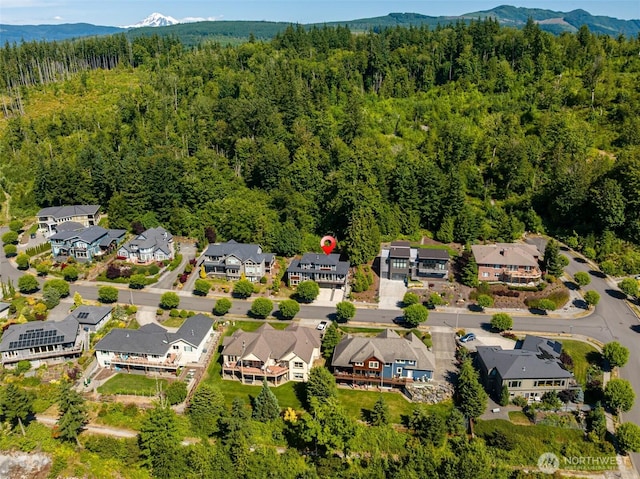 921 Whitewater Dr, Bellingham, WA 98229 - aerial view of residential area featuring a heavily wooded area and a mountain backdrop
