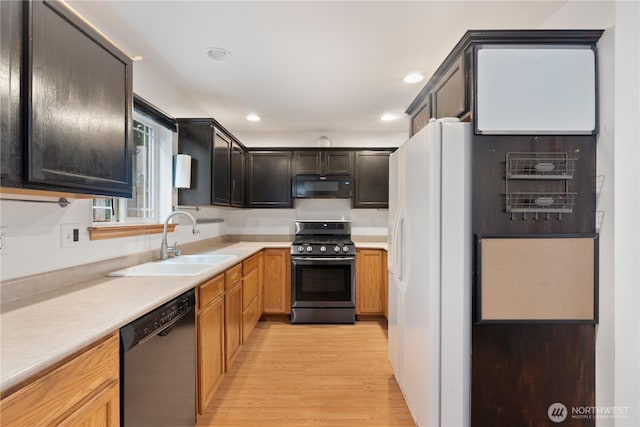 1625 Lincoln St, Bellingham, WA 98229 - kitchen featuring dishwashing machine, gas stove, black microwave, white fridge with ice dispenser, and light wood-type flooring