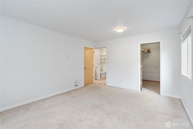 1625 Lincoln St, Bellingham, WA 98229 - unfurnished bedroom with carpet flooring, a spacious closet, connected bathroom, and a closet