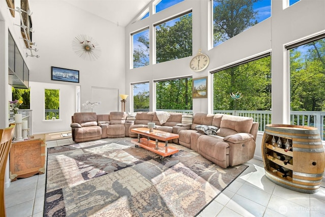 8894 Giles Rd, Blaine, WA 98230 - tiled living room featuring high vaulted ceiling and healthy amount of natural light