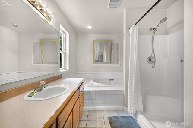 8894 Giles Rd, Blaine, WA 98230 - bathroom with a stall shower, vanity, a garden tub, and tile patterned floors
