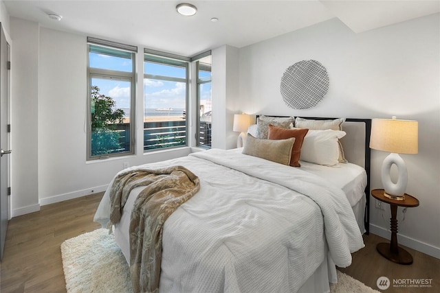 1706 Alki Ave SW Unit A, Seattle, WA 98116 - bedroom featuring wood finished floors and baseboards