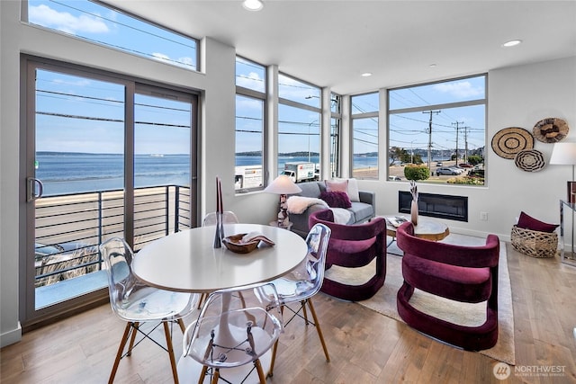 1706 Alki Ave SW Unit A, Seattle, WA 98116 - dining space featuring healthy amount of natural light, hardwood / wood-style floors, and recessed lighting