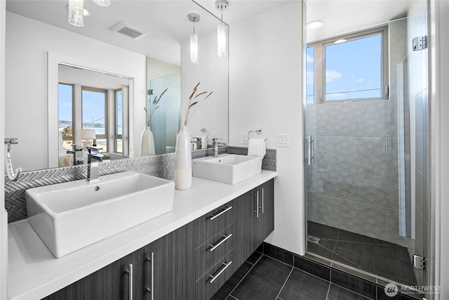 1706 Alki Ave SW Unit A, Seattle, WA 98116 - bathroom featuring double vanity, a stall shower, plenty of natural light, and tile patterned flooring
