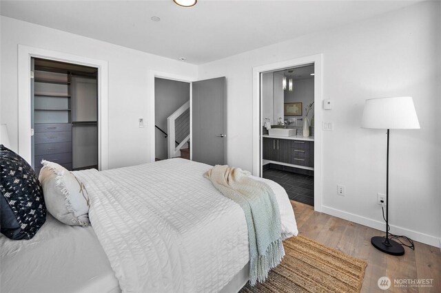 1706 Alki Ave SW Unit A, Seattle, WA 98116 - bedroom featuring wood finished floors and ensuite bath
