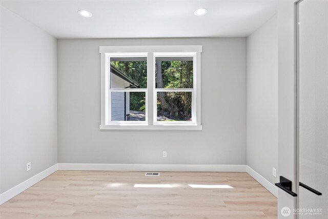 821 174th Ave NW, Lakebay, WA 98349 - spare room featuring light wood-style floors and recessed lighting