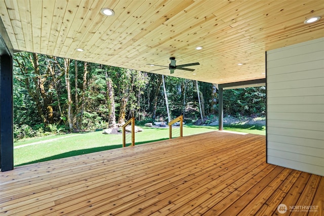 821 174th Ave NW, Lakebay, WA 98349 - wooden terrace featuring a lawn, a ceiling fan, and view of wooded area