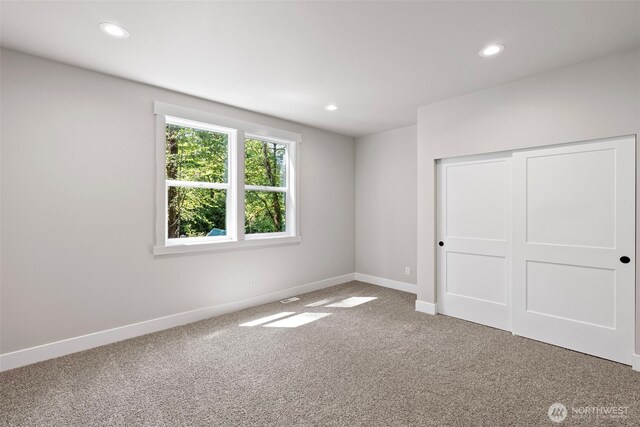 821 174th Ave NW, Lakebay, WA 98349 - unfurnished bedroom featuring carpet floors, recessed lighting, and a closet