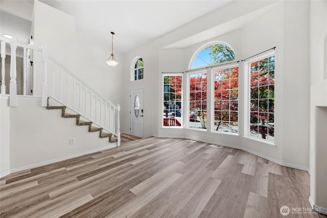 8618 217th Pl NE, Arlington, WA 98223 - foyer entrance featuring wood finished floors, a towering ceiling, and stairs