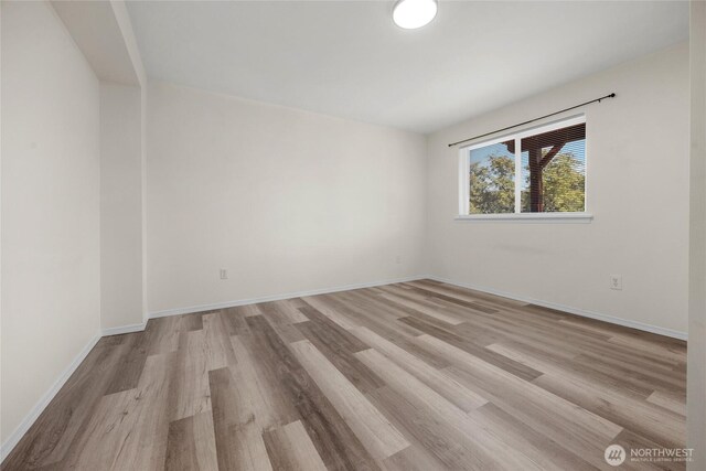 8618 217th Pl NE, Arlington, WA 98223 - unfurnished room featuring light wood finished floors and baseboards