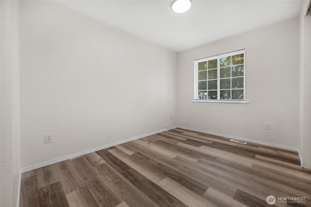 8618 217th Pl NE, Arlington, WA 98223 - empty room with wood finished floors and baseboards