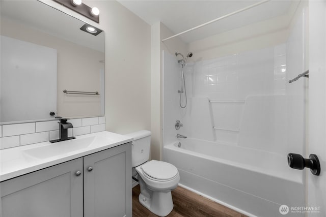 8618 217th Pl NE, Arlington, WA 98223 - bathroom with wood finished floors, vanity, bathing tub / shower combination, and backsplash