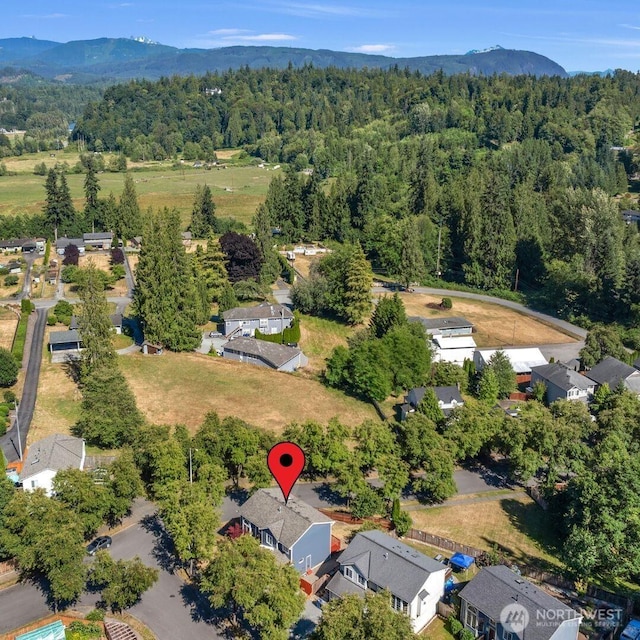 8618 217th Pl NE, Arlington, WA 98223 - aerial view of property and surrounding area with mountains and nearby suburban area