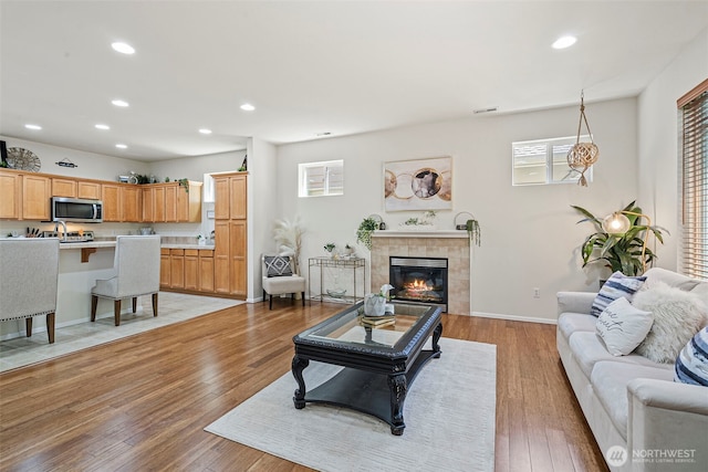 4318 3rd Ave NW, Olympia, WA 98502 - living room with plenty of natural light, recessed lighting, light wood-style floors, and a fireplace