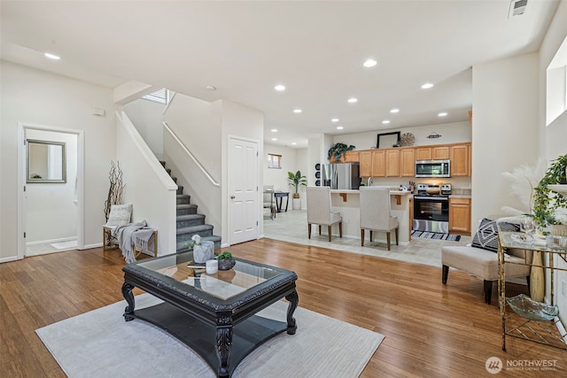 4318 3rd Ave NW, Olympia, WA 98502 - living room featuring stairs, light wood-style floors, and recessed lighting