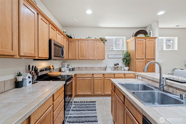 4318 3rd Ave NW, Olympia, WA 98502 - kitchen with stainless steel microwave, electric range, tile countertops, recessed lighting, and light tile patterned floors