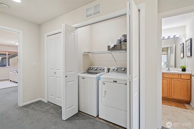4318 3rd Ave NW, Olympia, WA 98502 - laundry area featuring washing machine and clothes dryer and light colored carpet