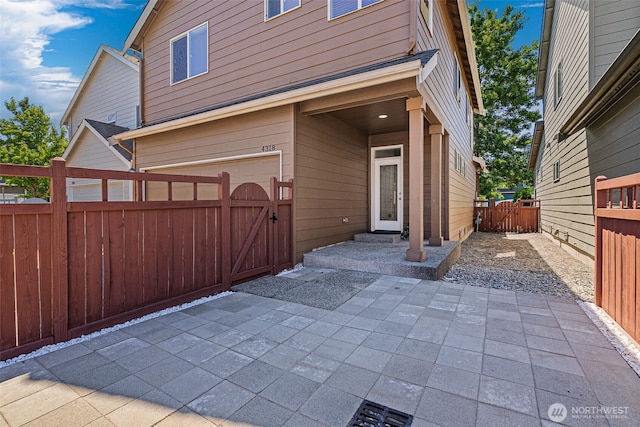 4318 3rd Ave NW, Olympia, WA 98502 - view of patio with a gate and an attached garage