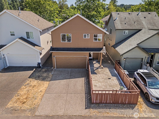 4318 3rd Ave NW, Olympia, WA 98502 - traditional home with concrete driveway and an attached garage