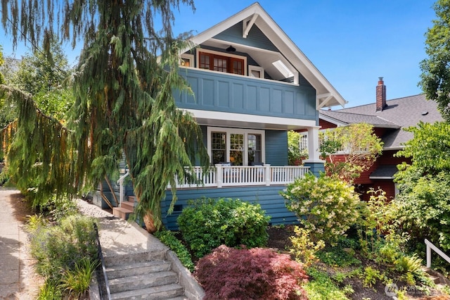 109 E Roanoke St, Seattle, WA 98102 - view of front of property featuring a balcony, stairway, and board and batten siding