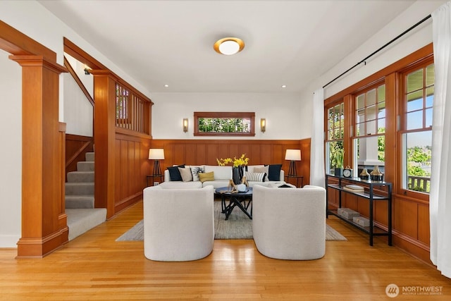 109 E Roanoke St, Seattle, WA 98102 - living room featuring wainscoting, stairs, light wood-style flooring, and recessed lighting