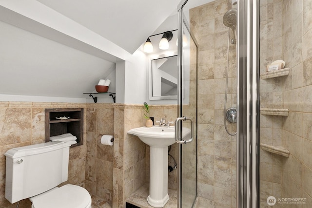 109 E Roanoke St, Seattle, WA 98102 - full bath featuring tile walls, a stall shower, and lofted ceiling