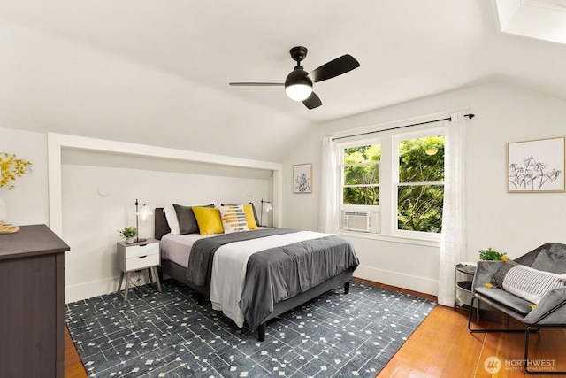 109 E Roanoke St, Seattle, WA 98102 - bedroom featuring vaulted ceiling, wood finished floors, a ceiling fan, and cooling unit
