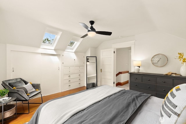 109 E Roanoke St, Seattle, WA 98102 - bedroom featuring lofted ceiling, a skylight, light wood-style flooring, and ceiling fan